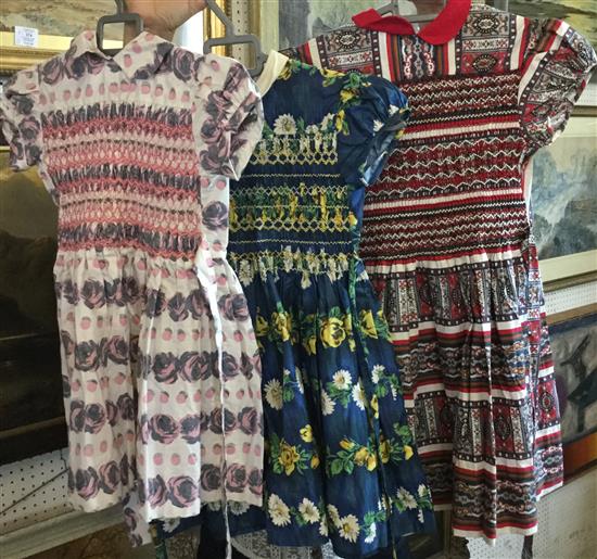 3 1960s childs printed & hand smocked day dresses